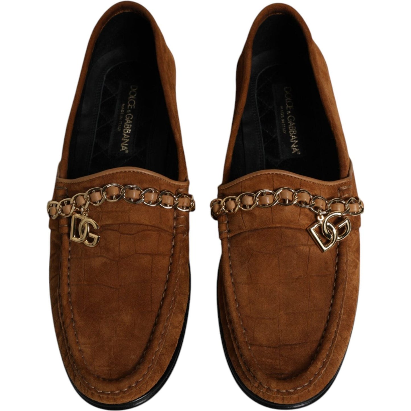 Dolce & Gabbana brown suede leather loafers with gold logo chain detail, featuring minor glue marks on the right shoe.