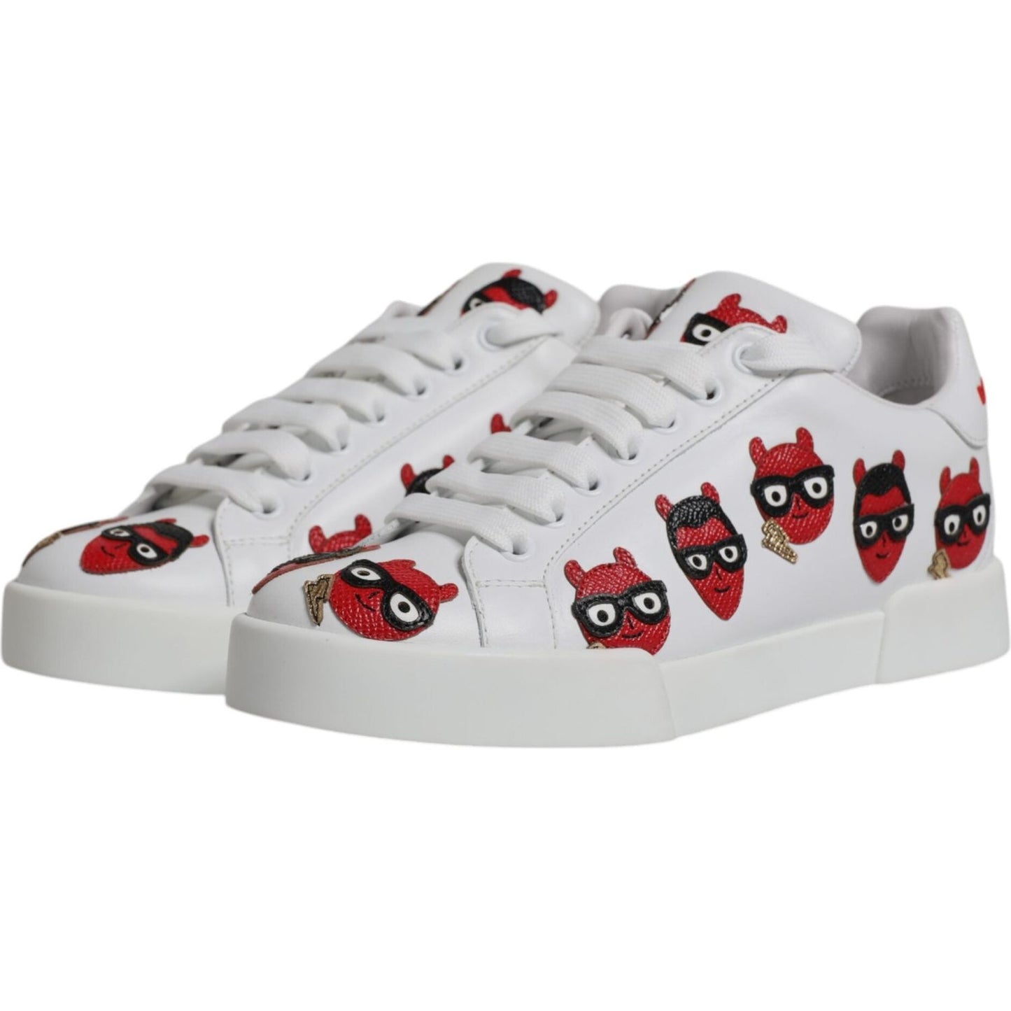Dolce & Gabbana Portofino sneakers with white leather, red devil faces, rubber sole, and lace-up closure. High-end craftsmanship.