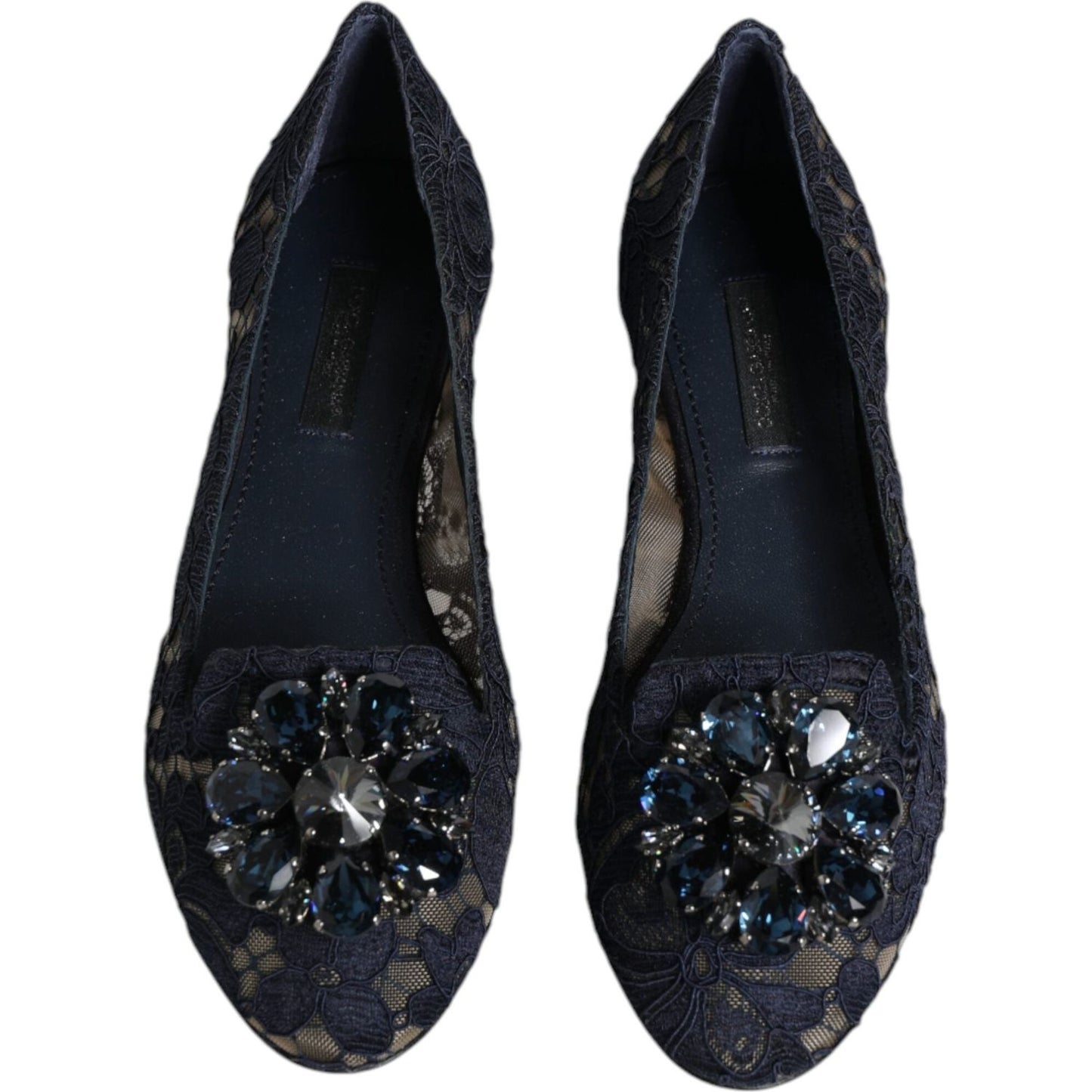 Dolce & Gabbana dark blue Taormina lace flats with crystal embellishments, almond toe, branded insole, and flat leather sole. Crafted in Italy.