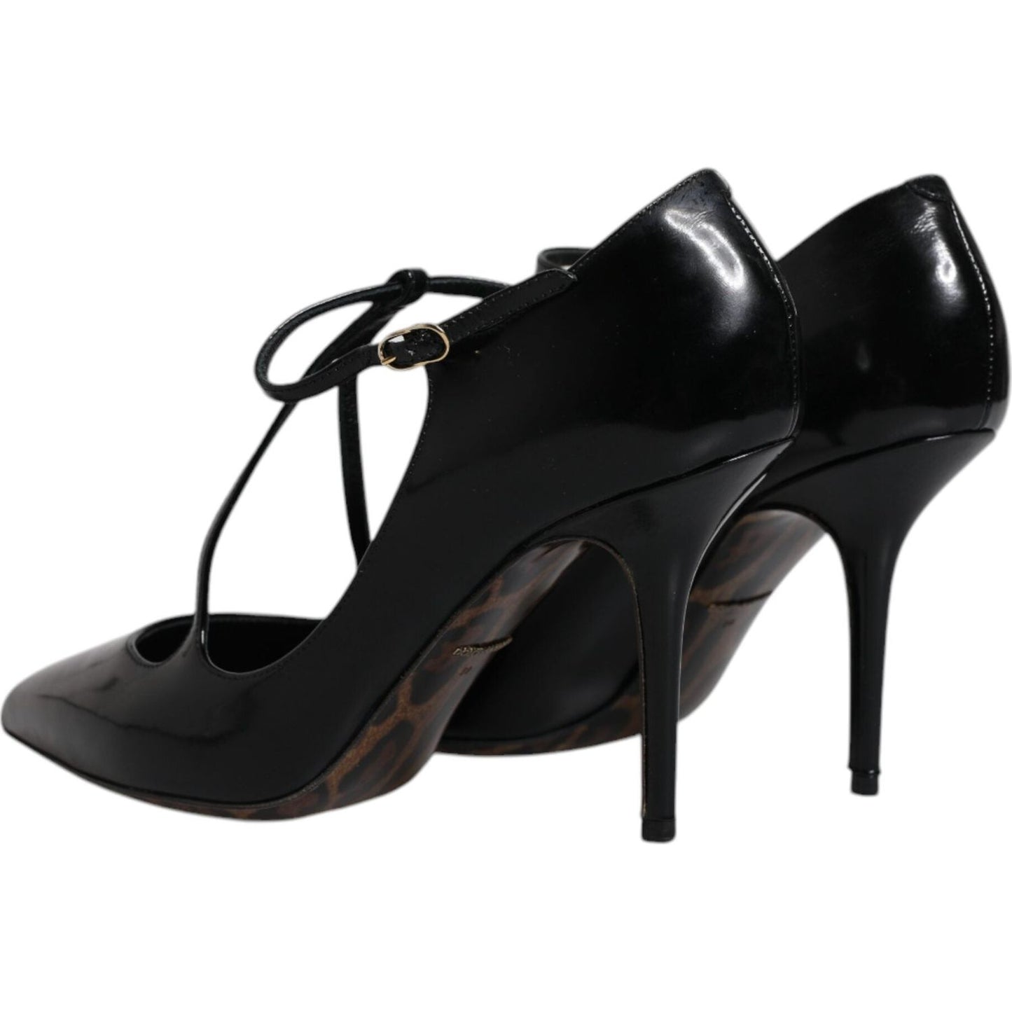 Dolce & Gabbana black leather t-strap stiletto heels, elegant design, buckle closure, Italian craftsmanship.