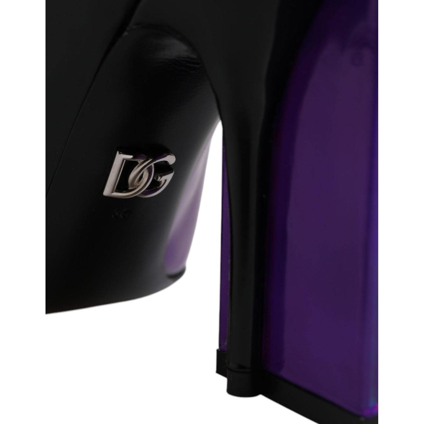 Close-up of Dolce & Gabbana logo on purple and black leather ankle boots with zipper closure, made in Italy.