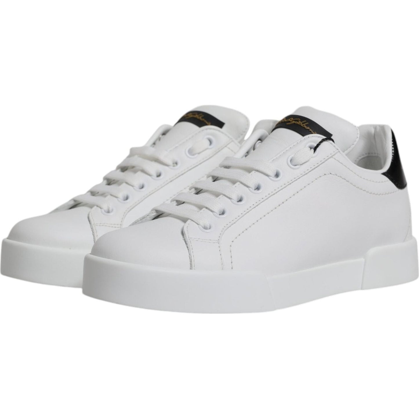 Dolce & Gabbana white leather low top sneakers with black logo, rubber sole, and lace-up closure. Made in Italy, high quality and comfort.