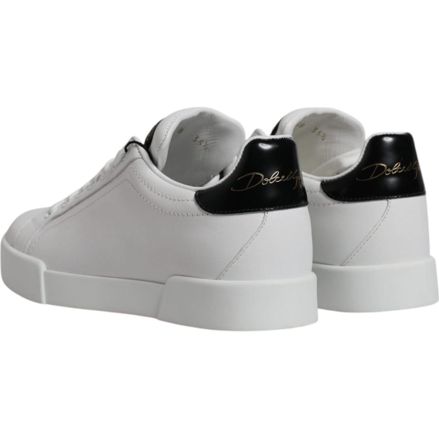 Dolce & Gabbana white leather classic low-top sneakers with black heel detail, rubber sole, and logo, made in Italy.
