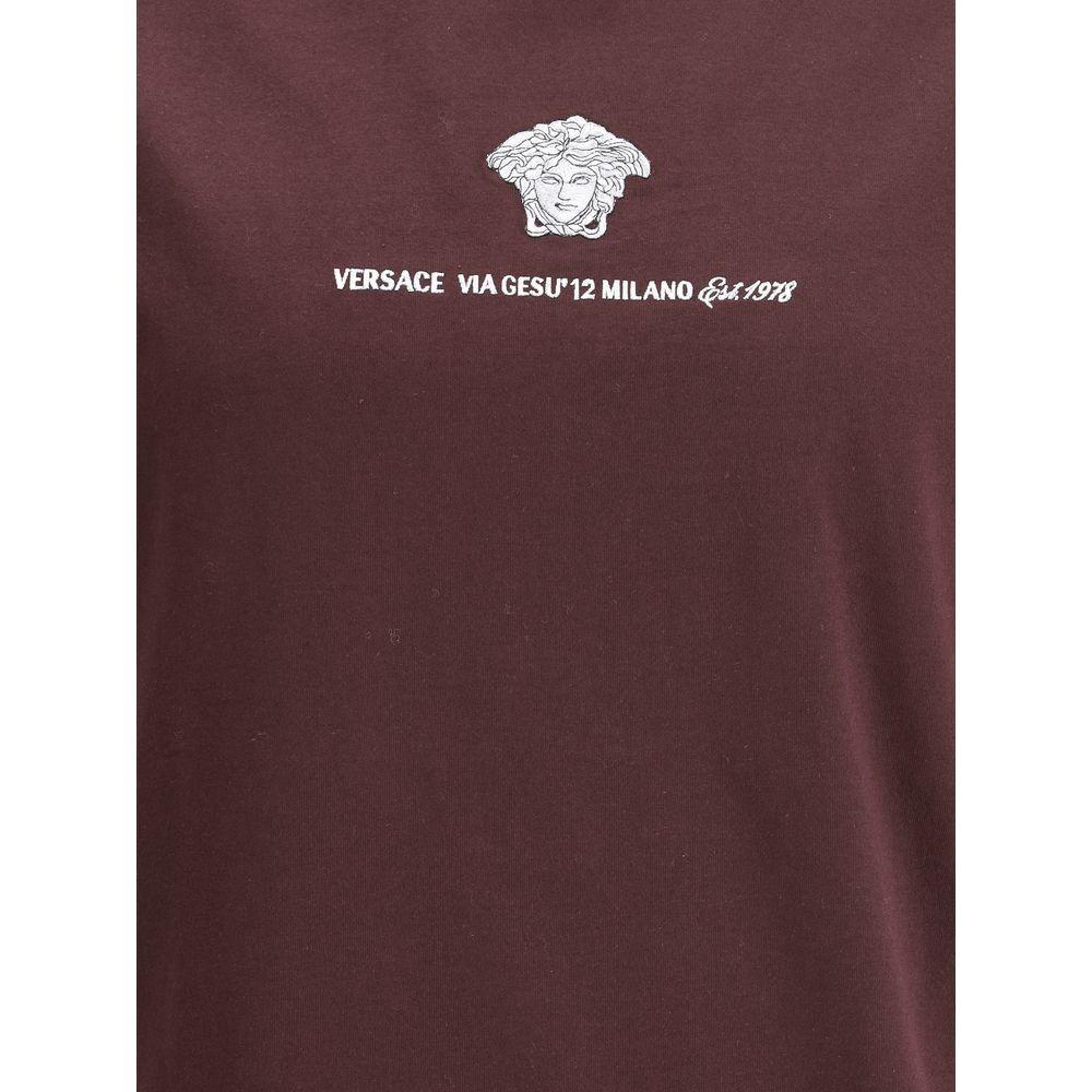 Versace cotton T-shirt with ribbed crew neck and contrasting brand monogram, featuring a monochrome pattern and regular fit.