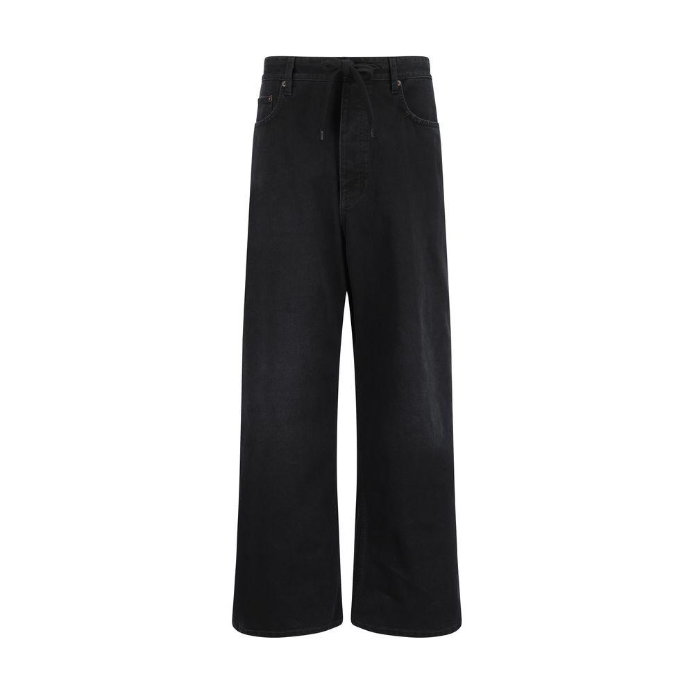 Balenciaga baggy jeans in black denim, featuring an oversized silhouette, classic five-pocket design, and signature back patch.