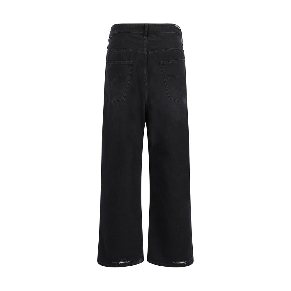 Back view of Balenciaga baggy jeans in black with oversized silhouette and signature patch, featuring five-pocket design and belt loops.