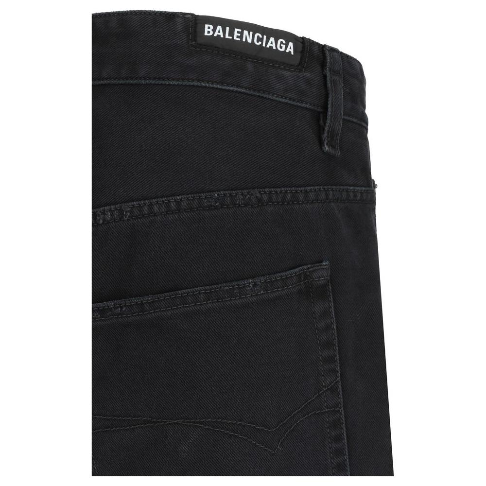 Close-up of Balenciaga baggy jeans with branded back patch and classic pocket design.