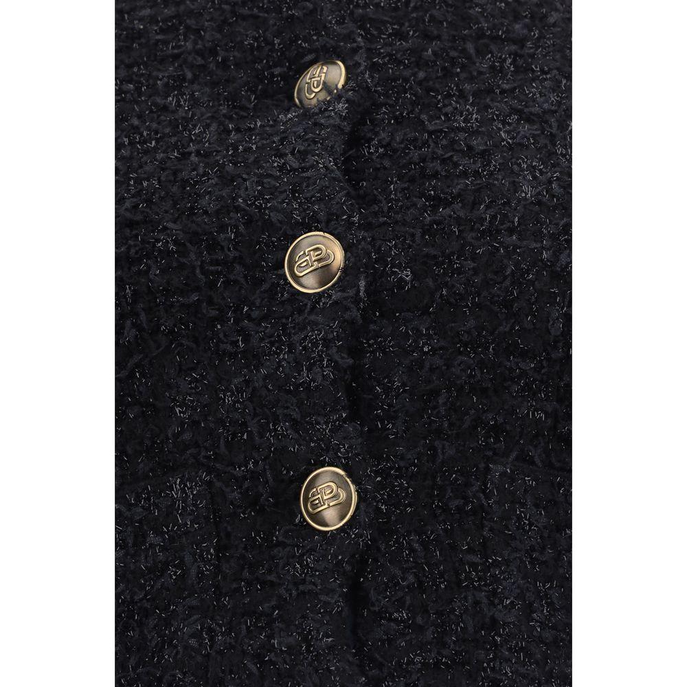 Close-up view of Balenciaga black cotton cardigan with contrasting buttons and all-over sequin detail.