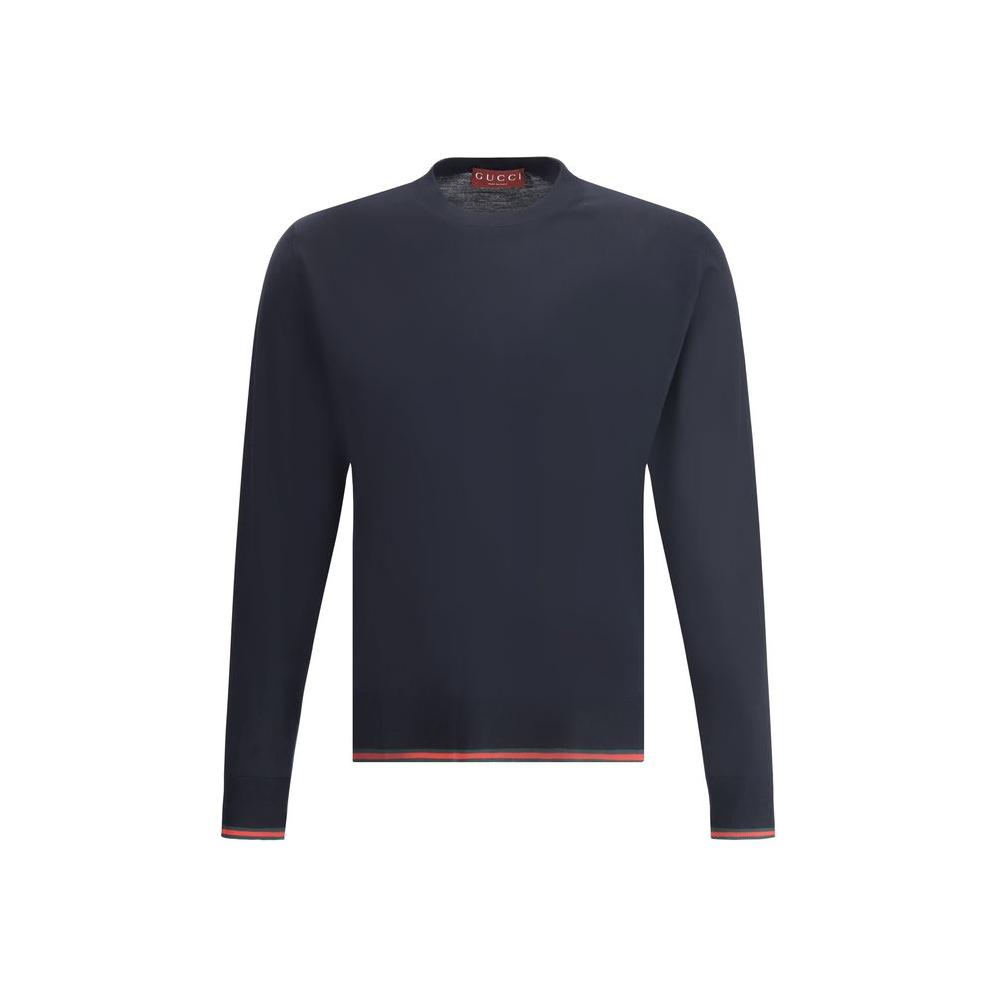 Gucci wool sweater with ribbed crew neck, multicolored cuffs and hem, featuring iconic brand design in monochrome, elegant fashion.