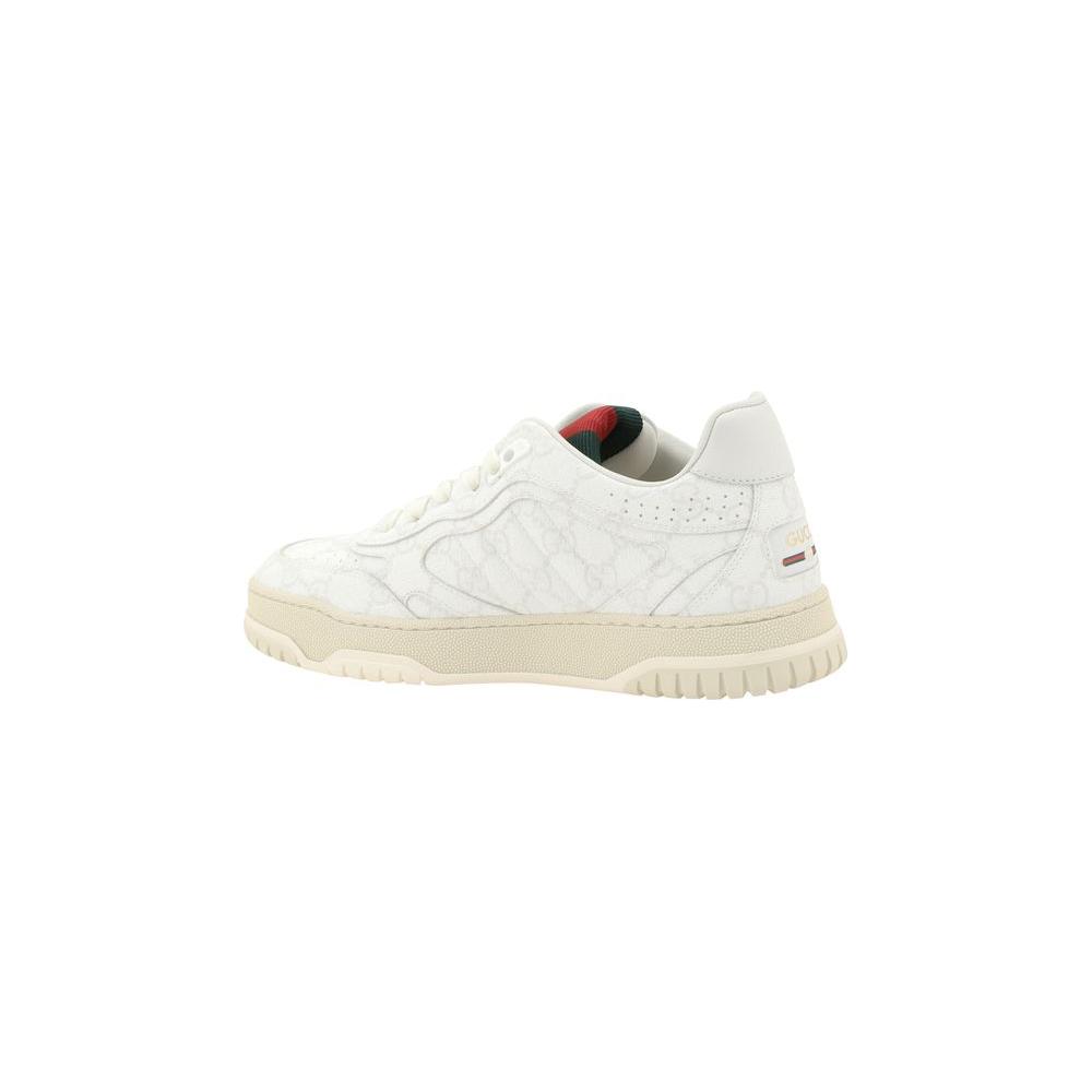 Gucci Logo Leather Sneakers with GG monogram, side view, showcasing luxury design and knurled sole.
