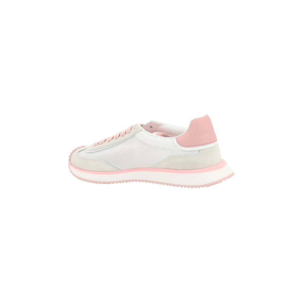 Dolce & Gabbana DG Cushion sneakers with suede paneling, pink accents, and notched sole, side view.