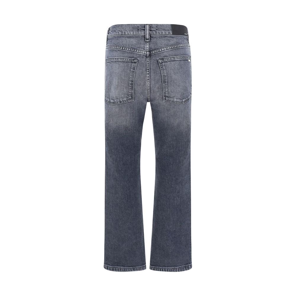 Back view of Amiri Denim Pants in gray with five-pocket design, leather patch, and straight cut.