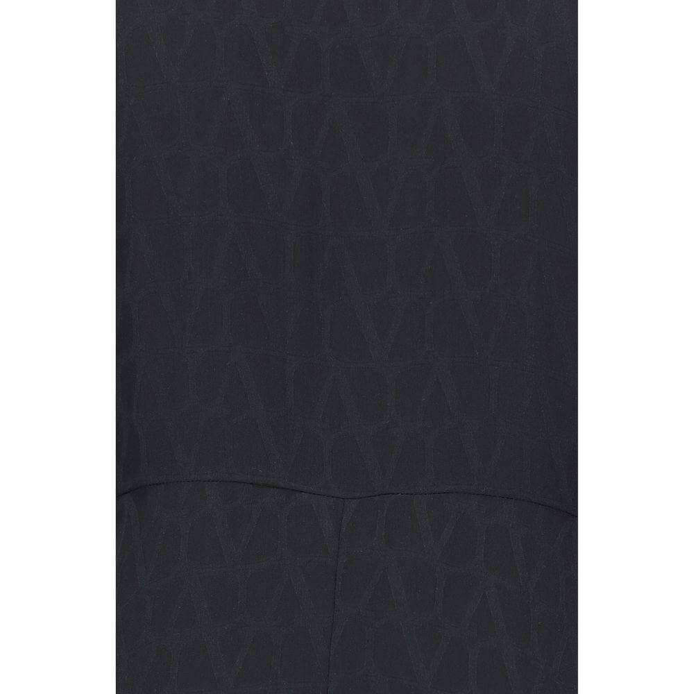 Close-up of Valentino Toile Iconographe silk fabric with dark intricate pattern design.