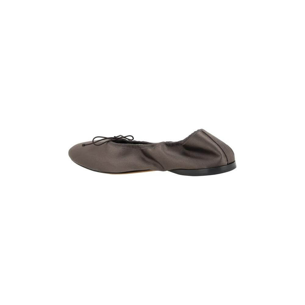 The Row Hereditas Ballerinas in satin with round toe, applique bow, elasticized heel, flat sole, and branded insole.