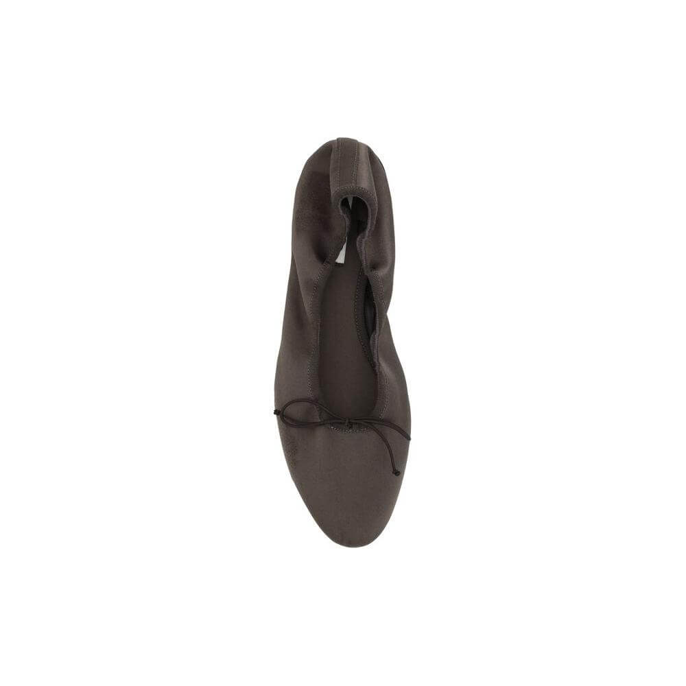 Top view of The Row Hereditas Ballerinas in satin with applique bow, elasticized heel, and flat sole.