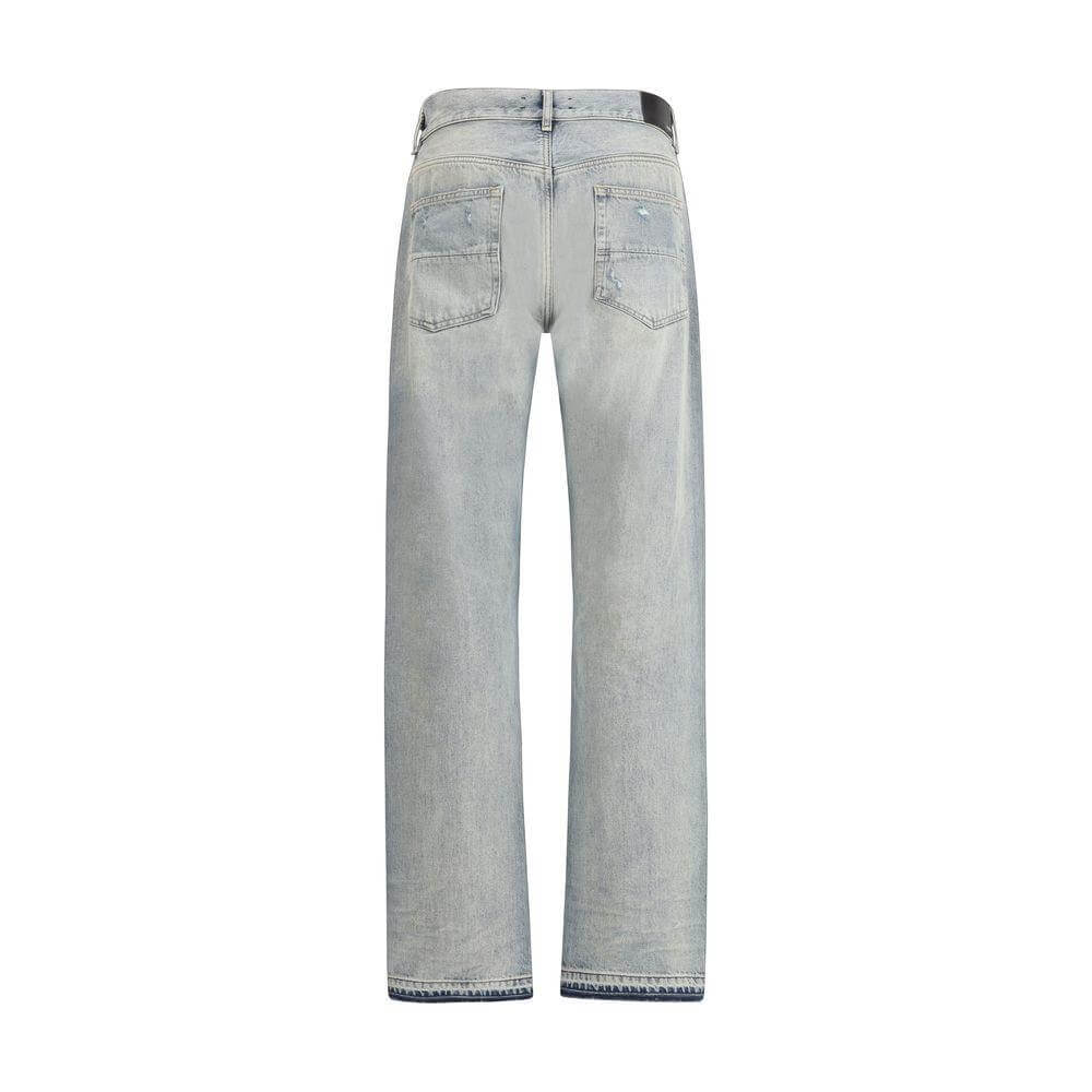 Back view of Amiri Released Jeans showcasing straight five-pocket style in light wash denim for a classic urban look.