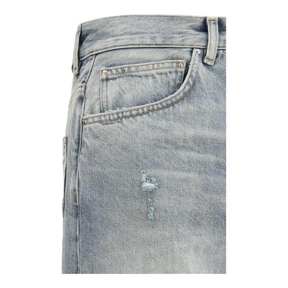 Close-up of Amiri Released Jeans showing the front pocket and distressed denim detail for urban and contemporary style.