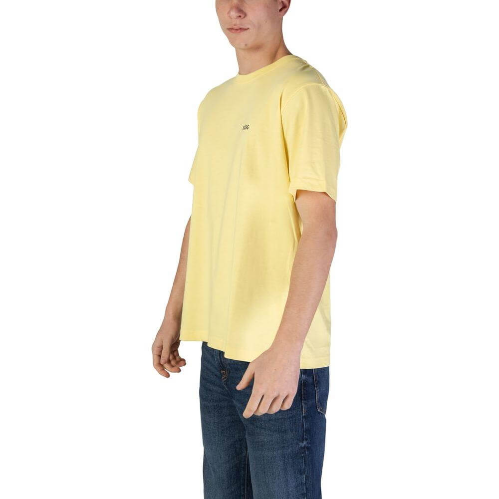 Hugo Boss yellow short-sleeved men's cotton t-shirt, fall/winter collection, side view on a model wearing jeans.