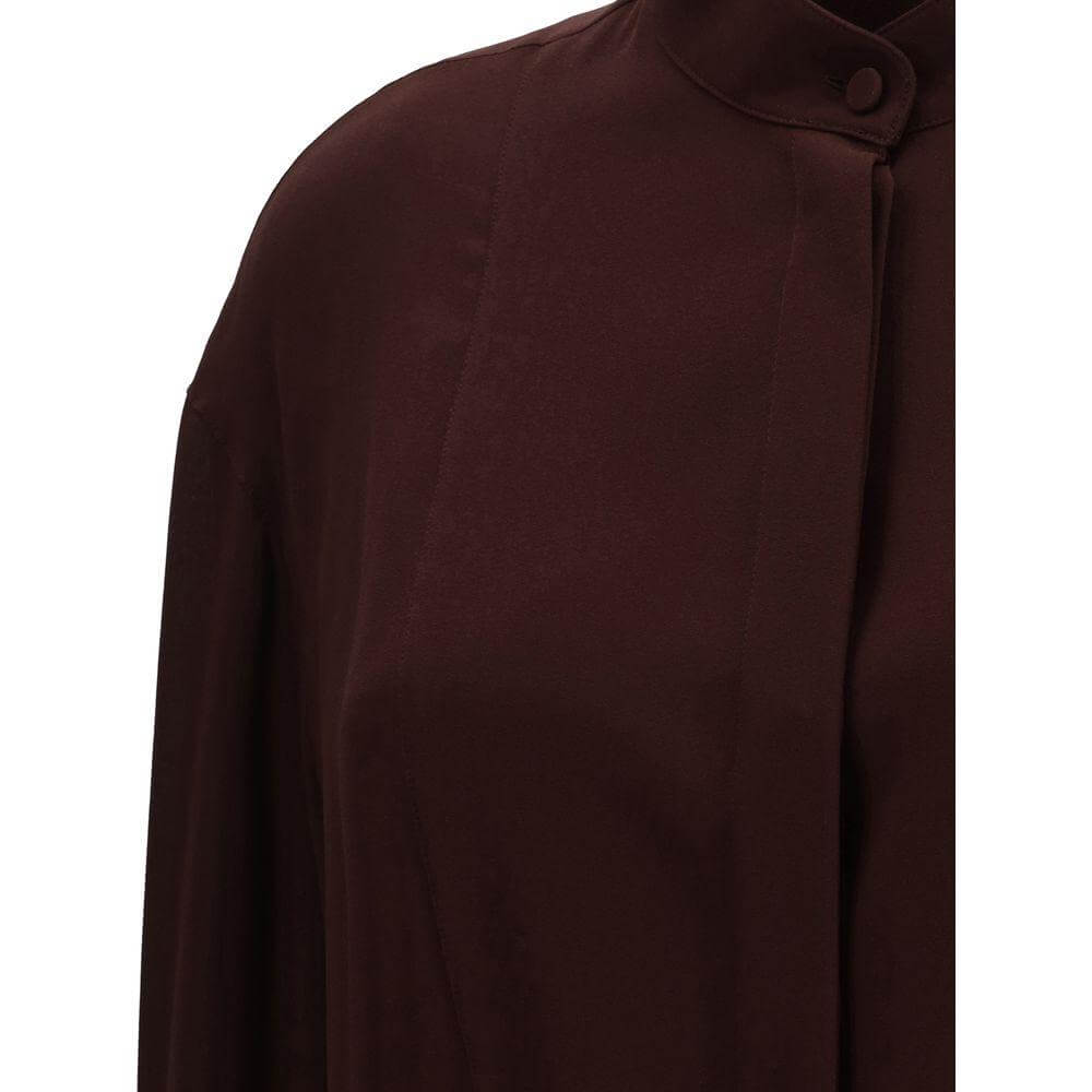 Close-up of Alexander McQueen Silk Chemisier Dress showing collar and front detail in rich fabric.