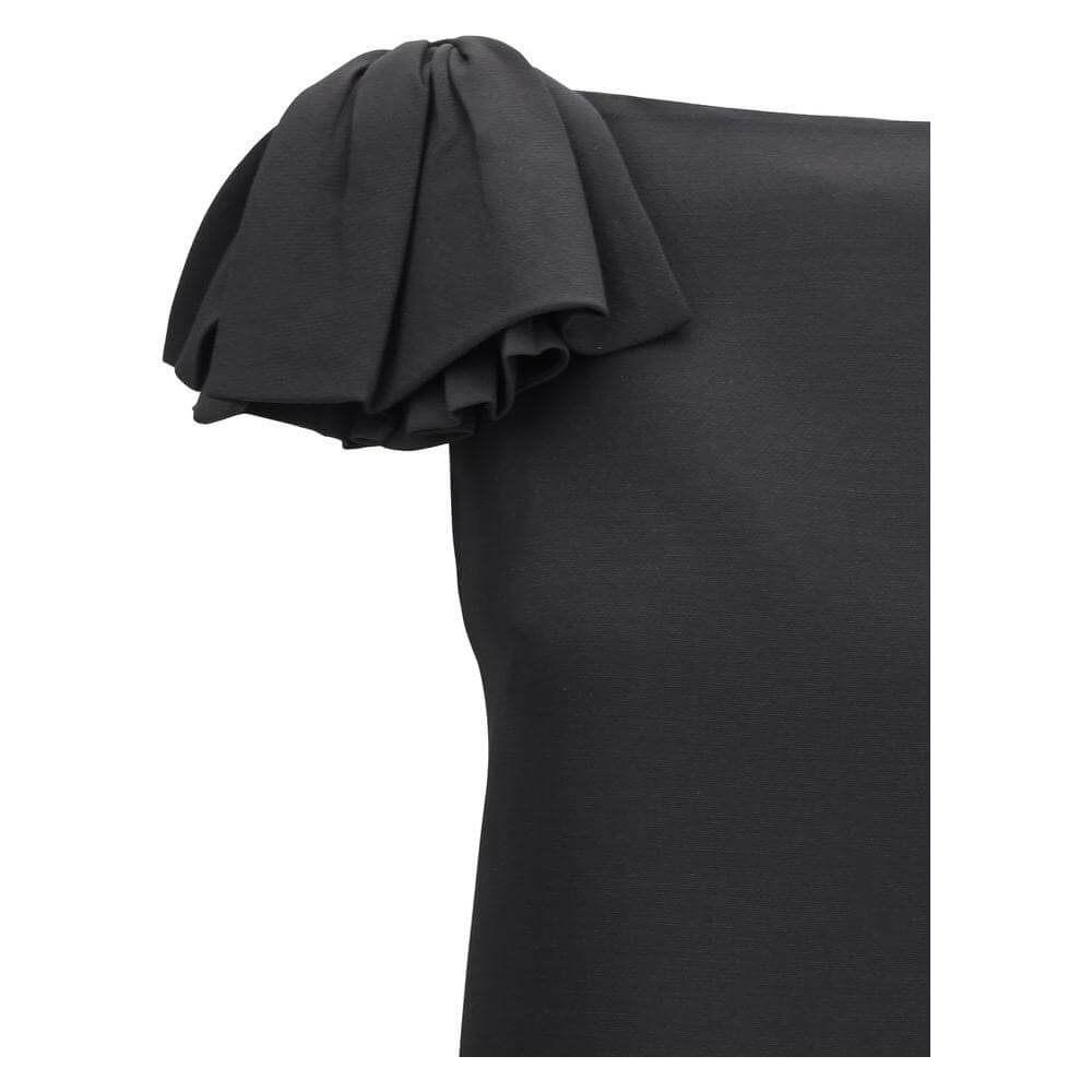 Valentino mini dress with bow detail on the shoulder, featuring a sleeveless design with a sleek black fabric and elegant silhouette.