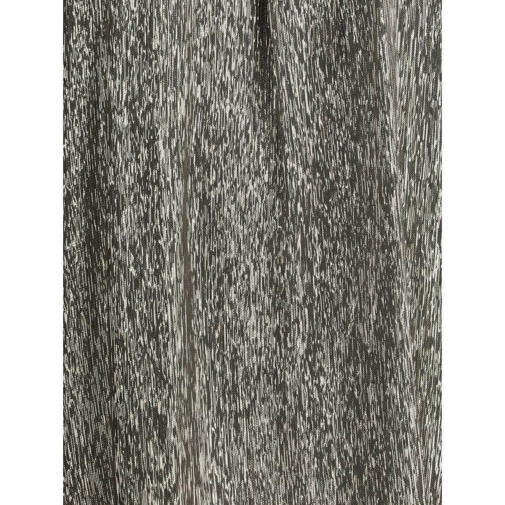 Close-up texture of Chloé silk lamé fabric in a shimmering light and dark pattern, perfect for elegant evening dresses.