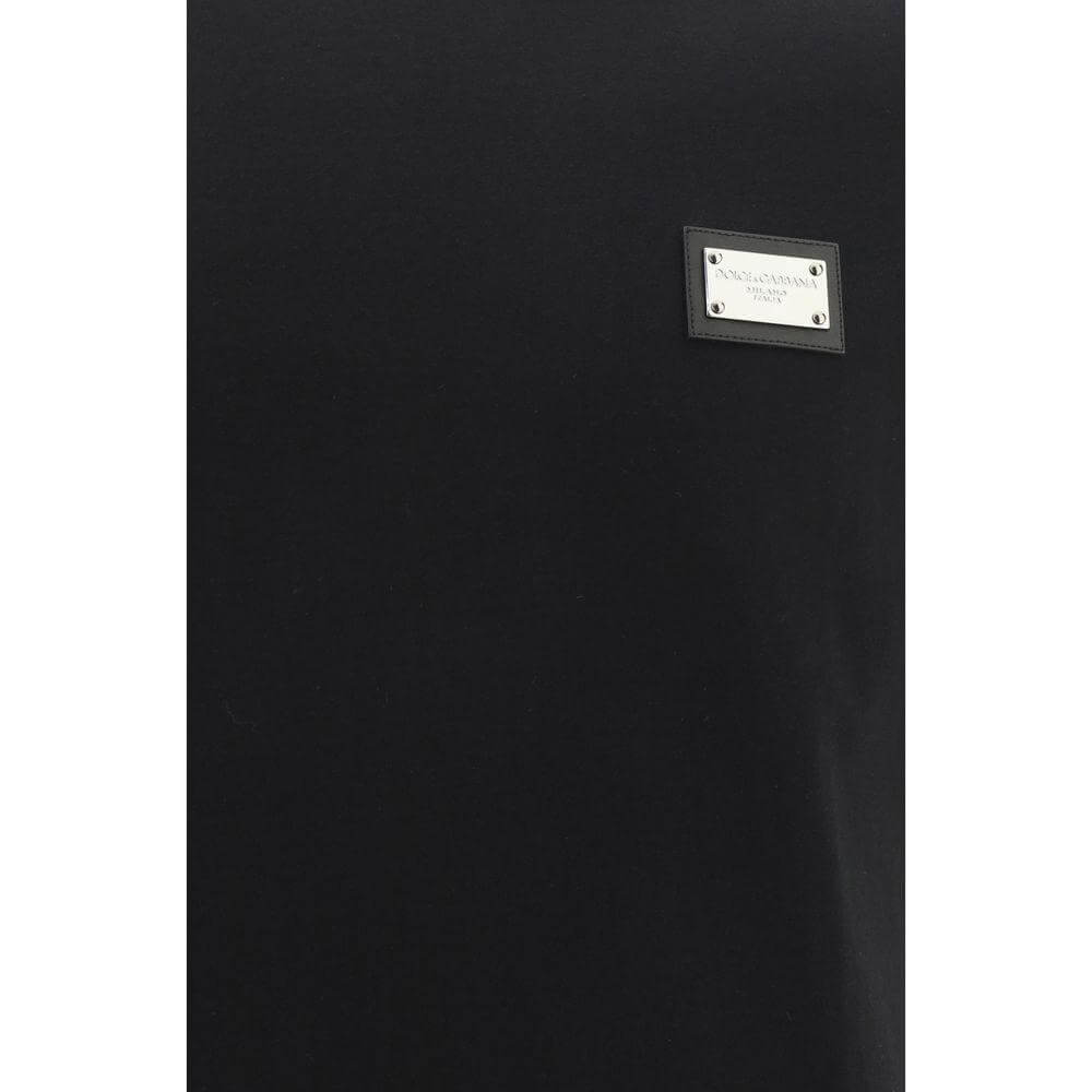 Dolce & Gabbana black cotton T-shirt with ribbed crew neck and metal plaque featuring D&G monogram, oversize fit.
