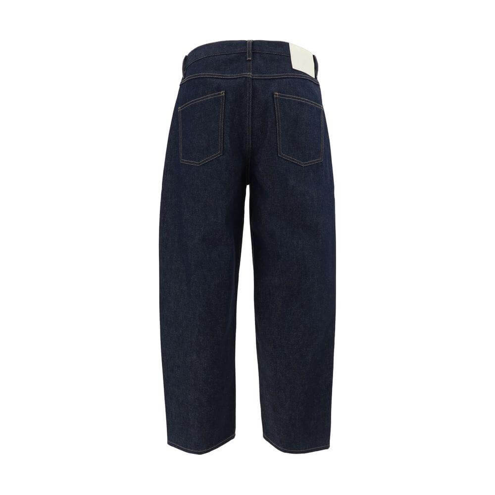 Rear view of Valentino cotton jeans showcasing five-pocket design and branded leather patch, dark denim finish.
