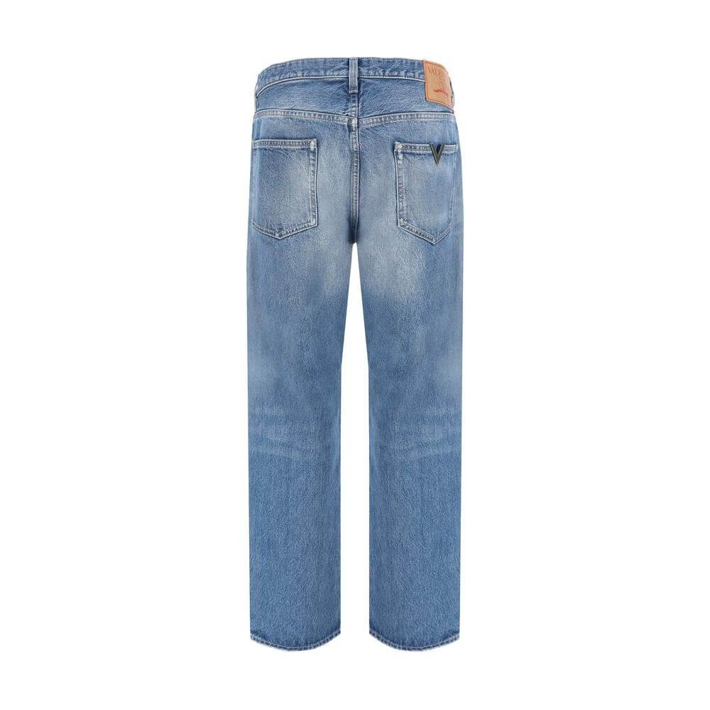 Back view of Valentino cotton jeans with five-pocket styling, VLogo plaque, and branded leather patch, showcasing regular fit design.