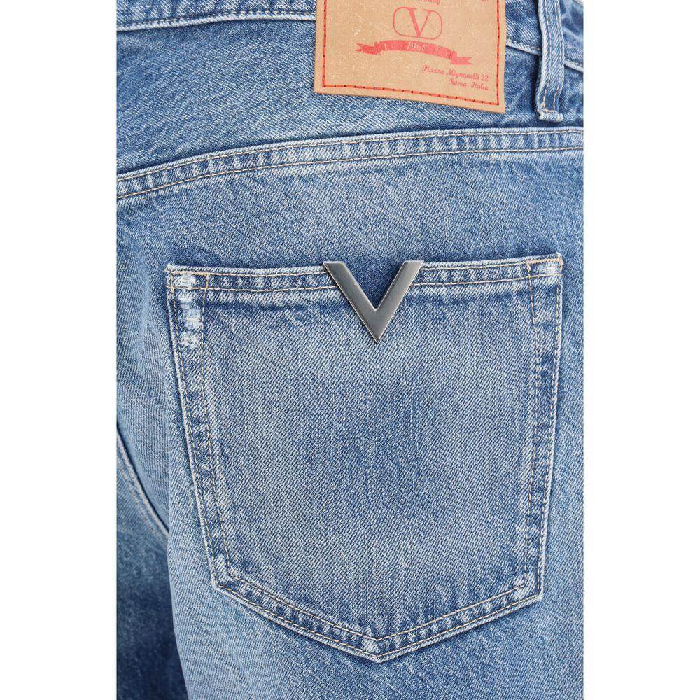 Back pocket detail of Valentino Cotton Jeans with metal VLogo plaque and branded leather patch.