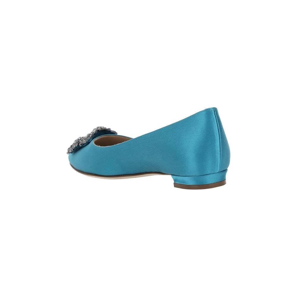 Side view of blue Manolo Blahnik Hangisi Ballerina with Swarovski detail, silk satin finish, and slight leather block heel.