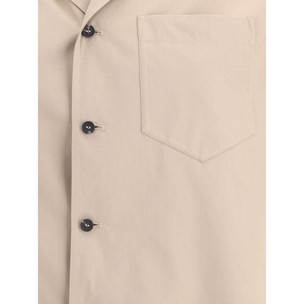 Fabiana Filippi trench jacket with classic lapels, button closure, and applique pocket in beige louisine cotton canvas.