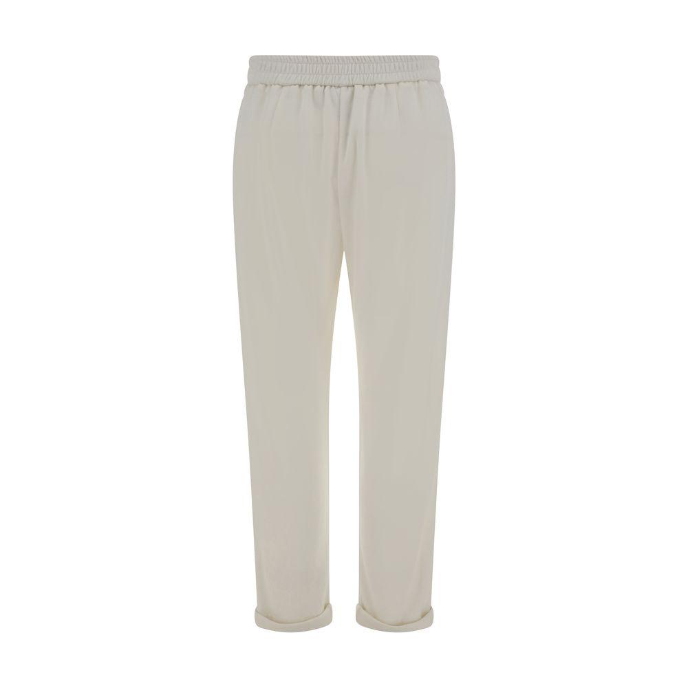 Brunello Cucinelli beige cotton pants with jeweled side pockets, elastic waistband, and cuffed hems for elegant comfort.