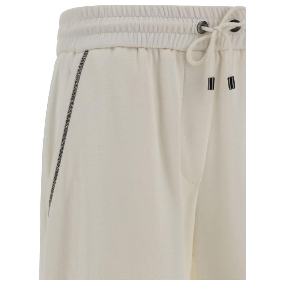 Brunello Cucinelli cotton pants with elasticated waistband and drawstring, featuring side pockets with jewel embellishments.