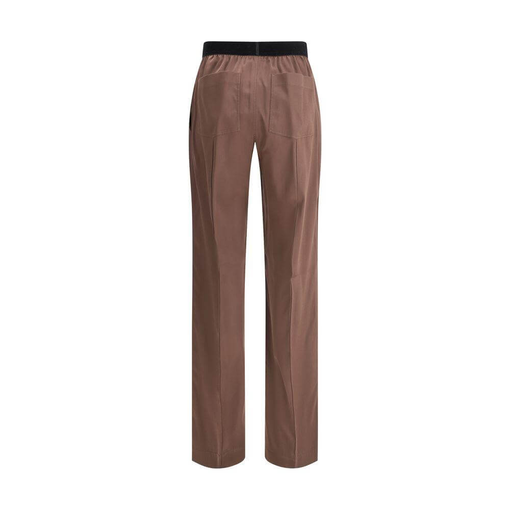 Back view of Tom Ford silk pants with elastic waistband and pockets, showcasing luxury fashion style.