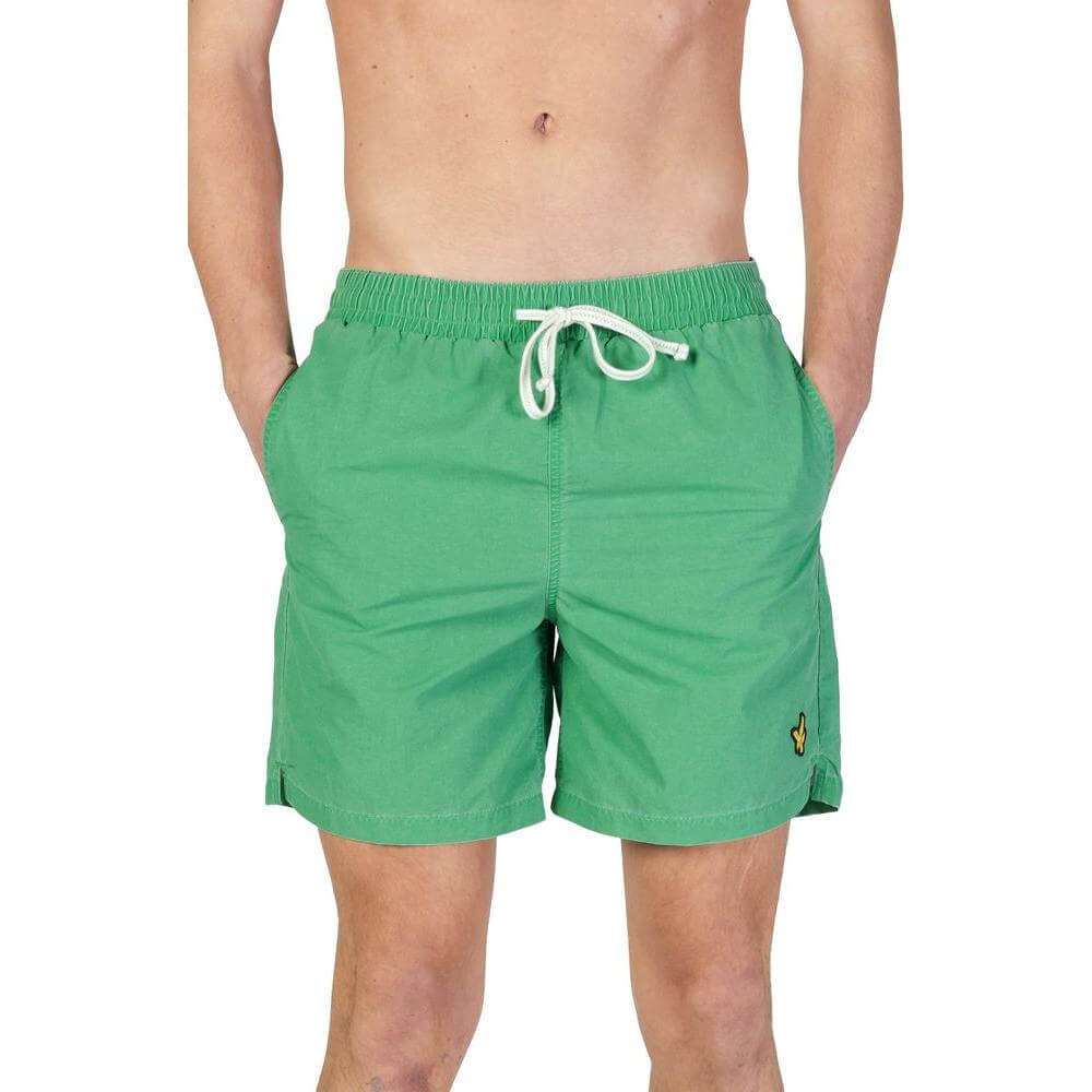 Lyle & Scott men's green nylon swimwear for fall/winter collection, featuring adjustable drawstring and logo patch on left leg.
