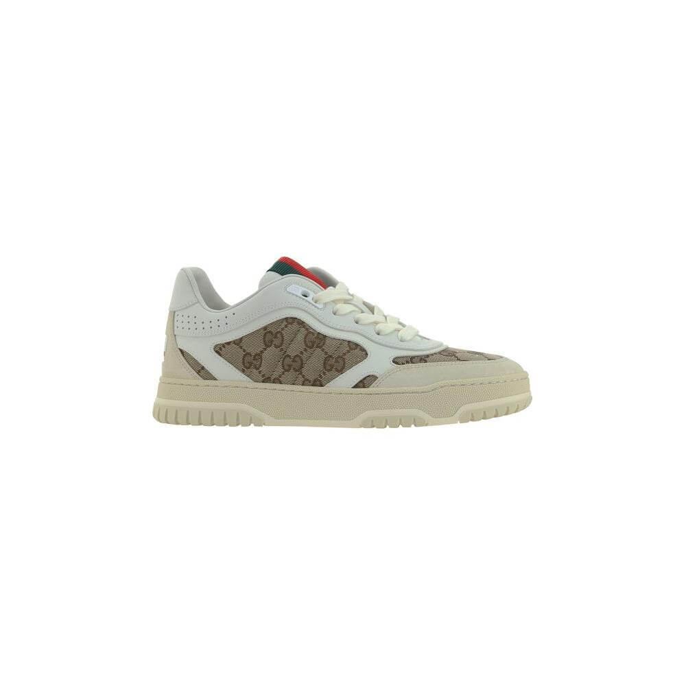 Gucci calfskin sneakers with textured panels, lace-up front, platform sole, leather details, iconic GG logo, and contrasting accents.