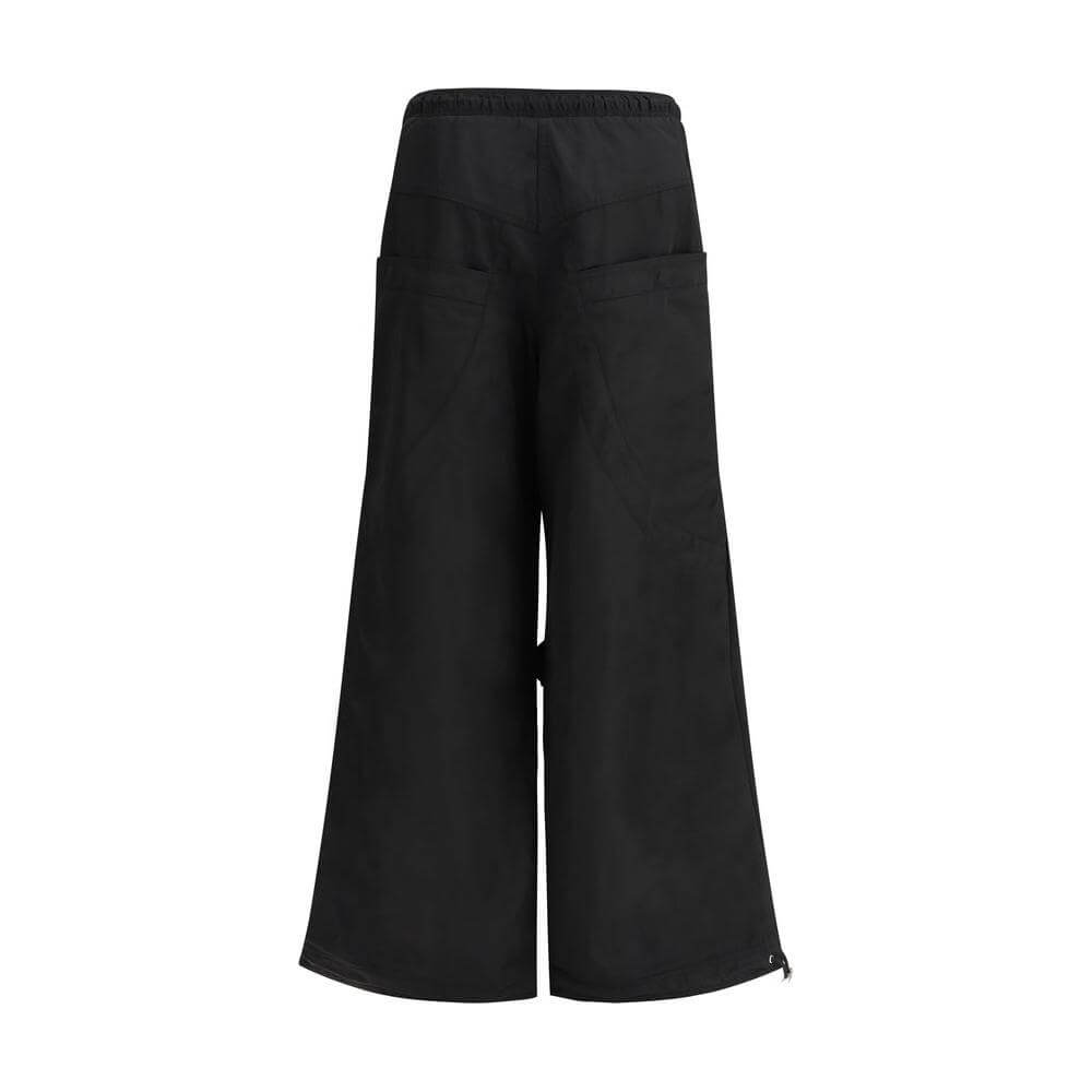 The Attico Nylon cargo pants with drawstring elastic waistband and multiple pockets, wide-leg urban style.