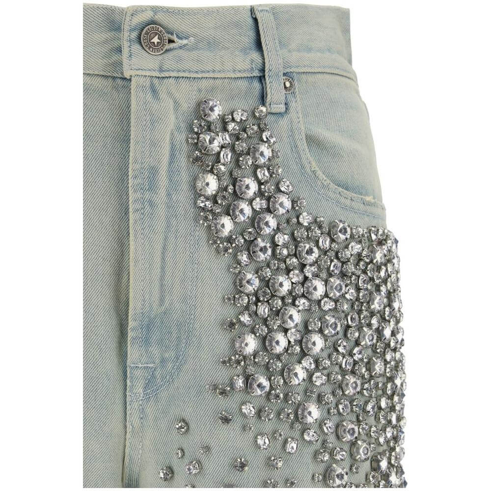 Close-up of Golden Jeans by Golden Goose with rhinestone embellishments on the front, showcasing urban style and glam details.