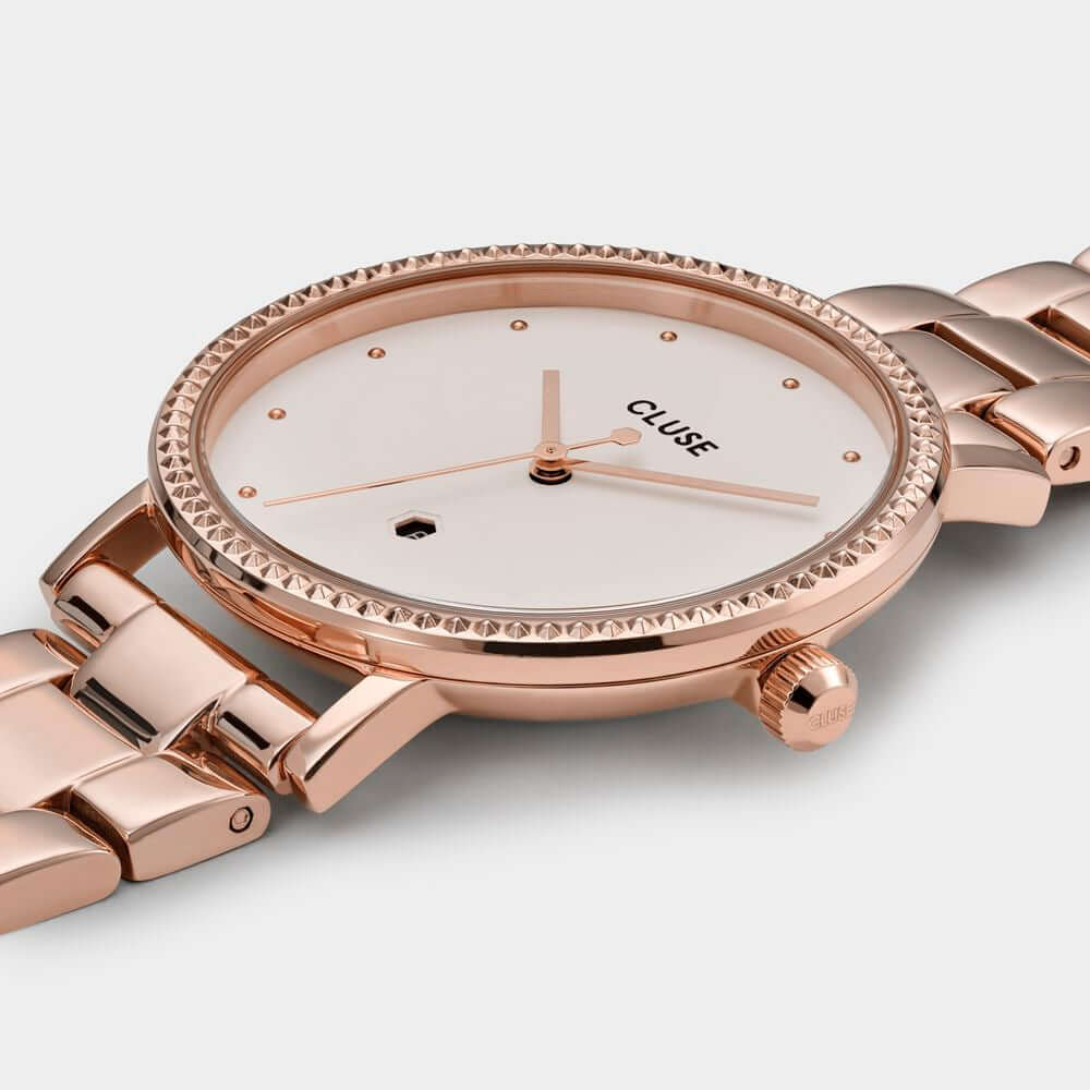 Cluse multicolor stainless steel watch with pink case and bracelet, white dial, quartz mechanism, analog display, 3 ATM water resistance.