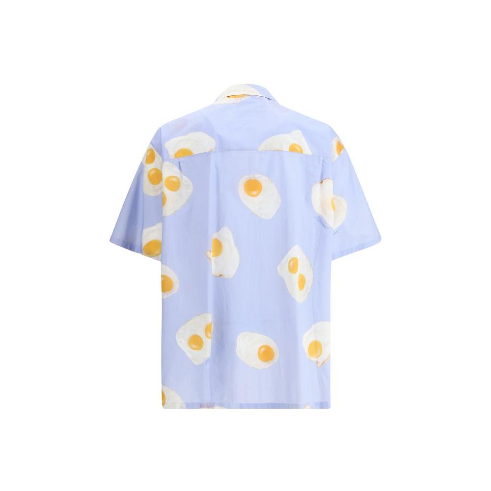 Moschino short sleeve shirt with egg print, button closure, and classic lapels, showcasing playful and unique style.