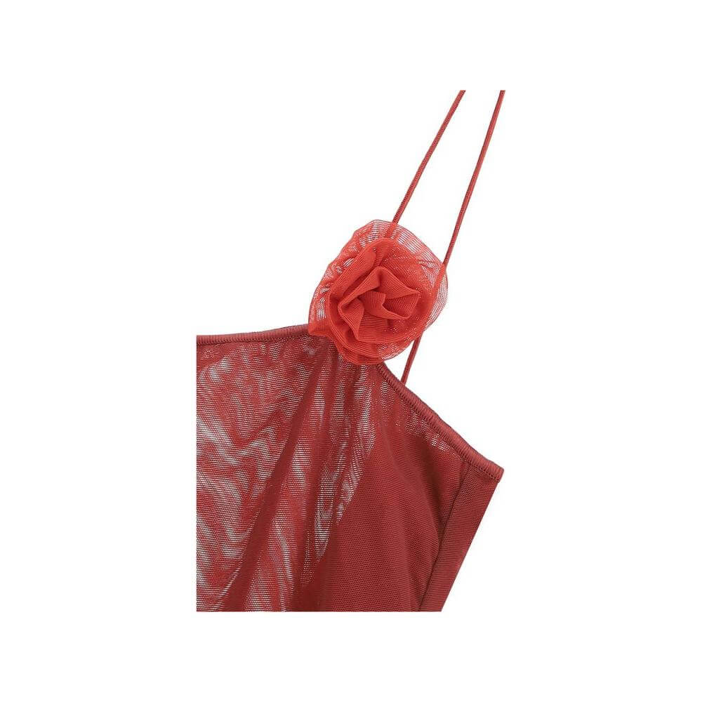 Close-up of Oséree Rose Swimsuit featuring thin straps and 3D rose appliqué in a semi-transparent tone-on-tone design.