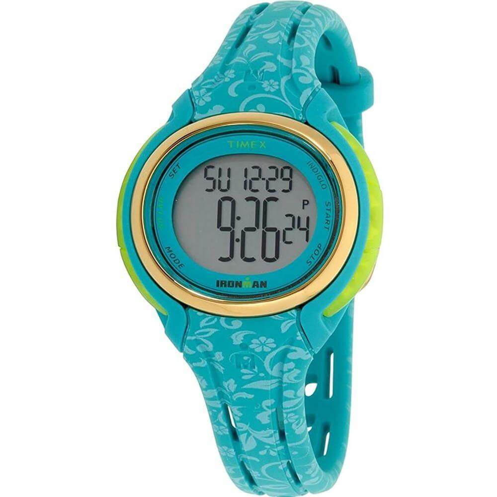 Timex light blue synthetic watch with digital quartz movement, floral silicone bracelet, 10ATM water resistance, 38mm dial, buckle closure.