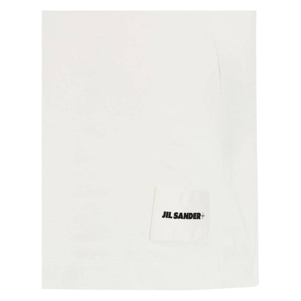 Jil Sander minimalist cotton T-shirt with ribbed crew neck and embroidered monogram patch, ideal for a simple high-fashion look.