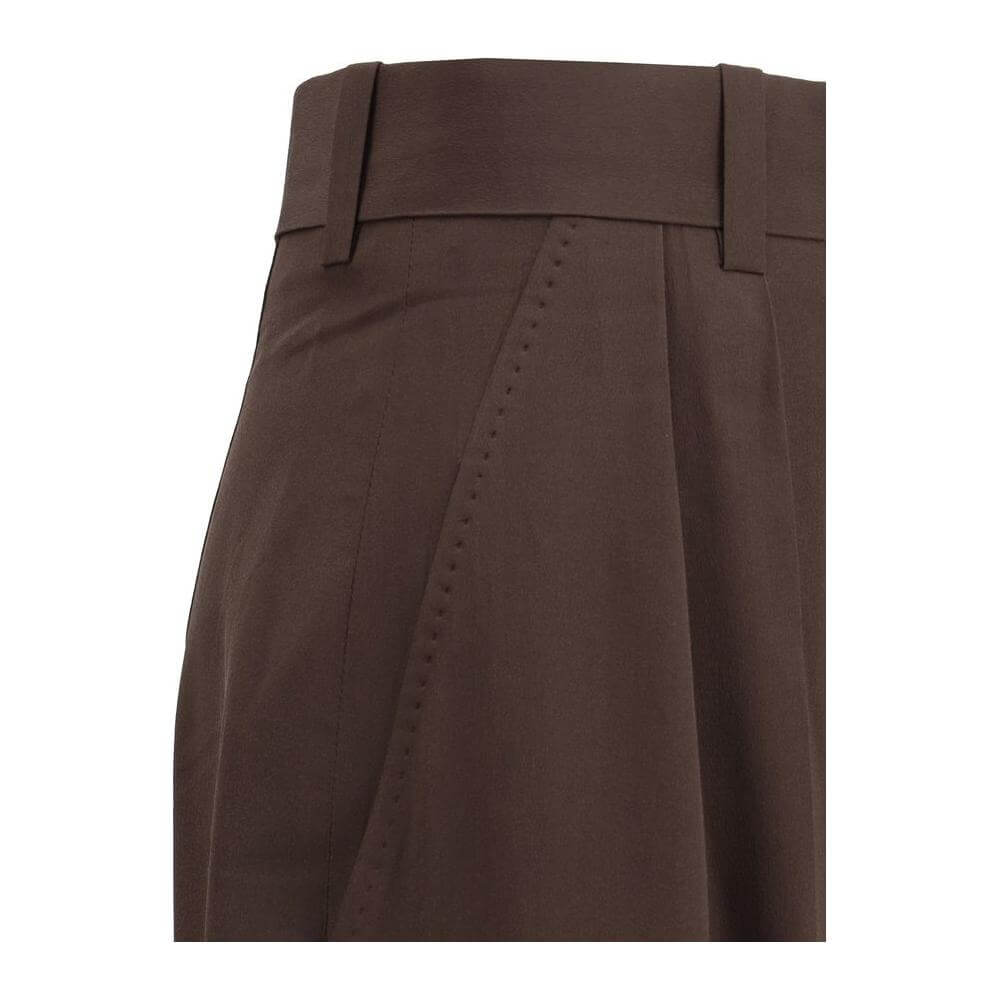 Close-up of Petar Petrov high-waisted silk pants showcasing the elegant wide-leg design and precise stitching details.
