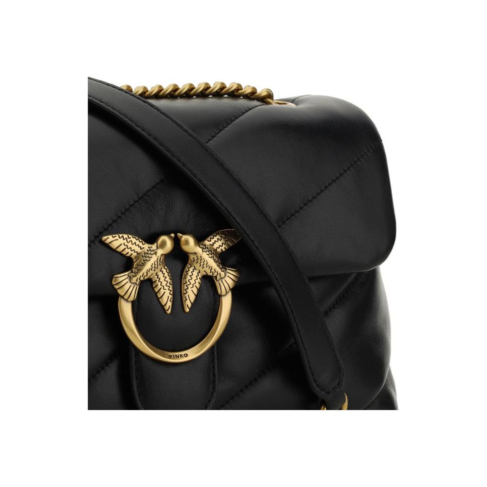 Close-up of Pinko Love Classic black calfskin shoulder bag with gold Love Birds logo and quilted design.