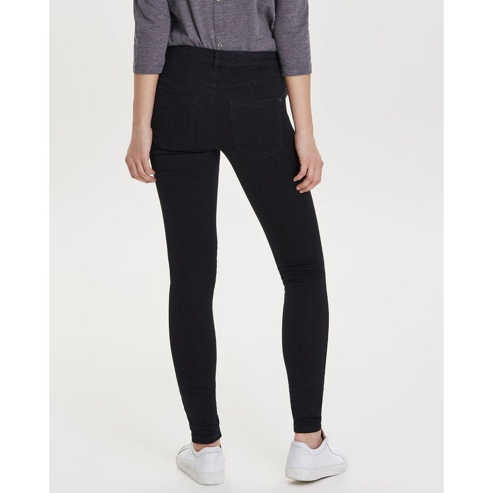 Woman wearing Only Black Cotton Jeans showcasing skinny fit and comfort with 70% cotton blend, ideal for versatile occasions.