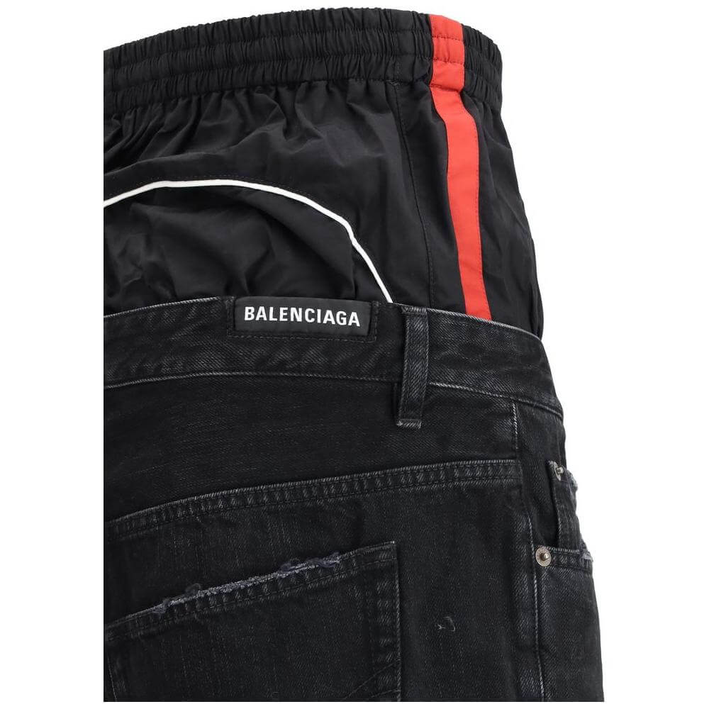 Balenciaga Layered Jeans with double-layered waist, featuring elasticated nylon waistband and classic five-pocket design for a bold look.