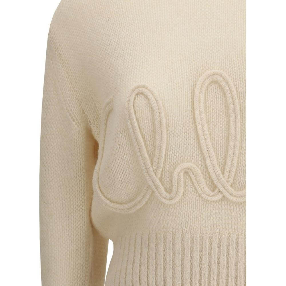 Chloé Alpaca Sweater with ribbed crew neck, hem, and cuffs, featuring brand's iconic signature stitched on the front.