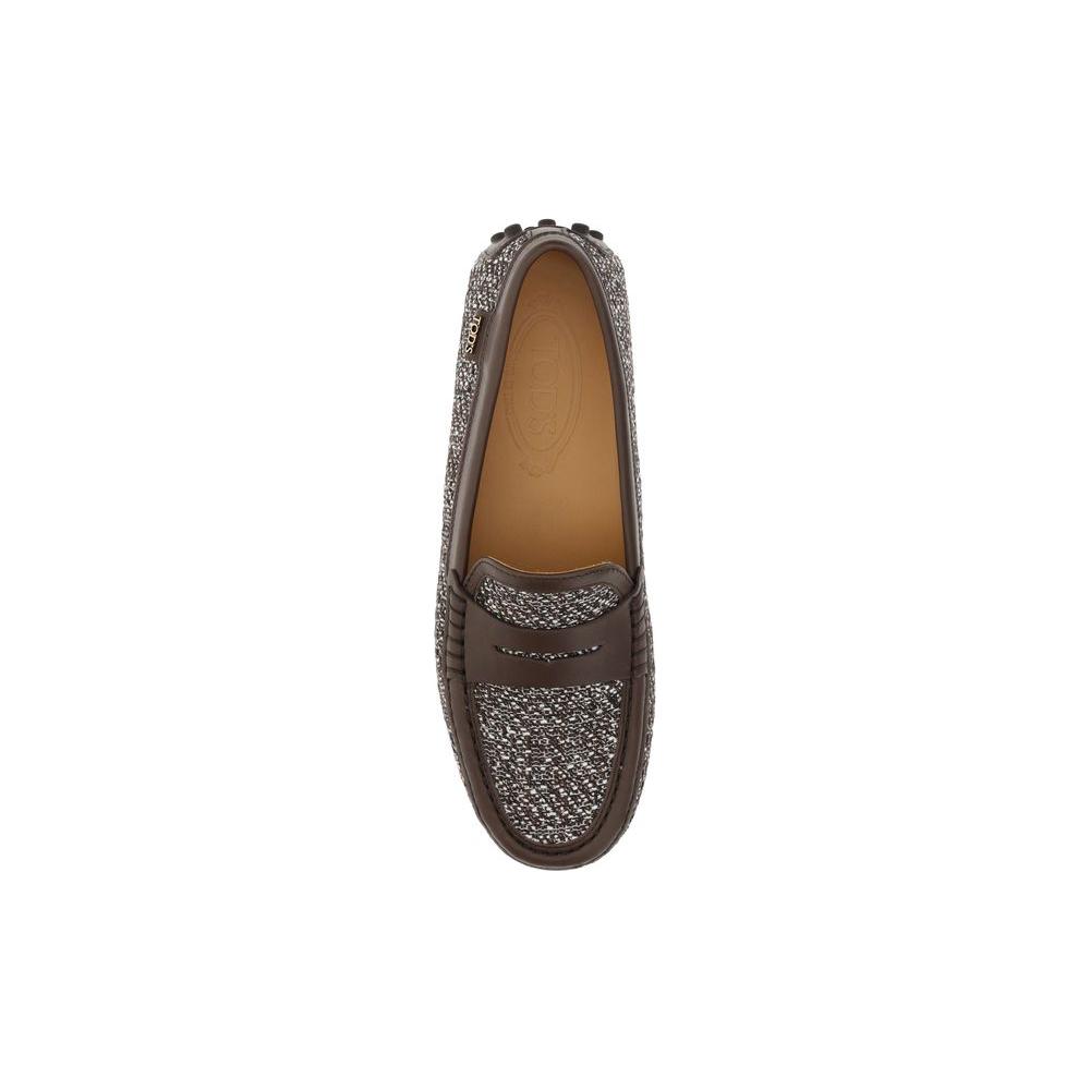 Tod's Tweed Gommino Loafers with leather and tweed design, round toe, non-slip rubber lugs, and embossed logo insole. Top view.