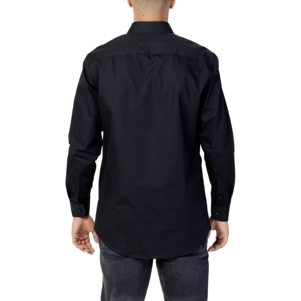 Back view of men's black cotton long-sleeve shirt, classic design suitable for formal or casual wear.